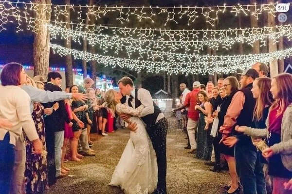 Bride and groom celebrating at Kick Back Ranch, a top event venue near Montgomery, Alabama